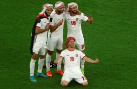 Jordan's players celebrate after defeating South Korea 