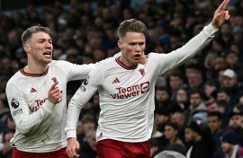 Manchester United's Scott McTominay (R) celebrates scoring the winner at Aston Villa
