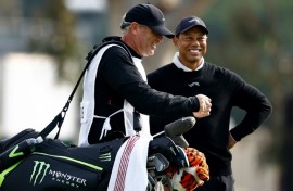 Golf superstar Tiger Woods enjoys a laugh with his caddie Lance Bennett during the pre-tournament pro-am at the US PGA Tour Genesis Invitational at The Riviera Country Club