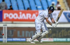 England's captain Ben Stokes plays a shot during the fourth day of the third Test cricket match between India and England at the Niranjan Shah Stadium in Rajkot on February 18