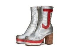 Elton John's monogrammed silver leather boots sold for nearly $100,00 at auction in New York