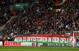 Football fans protest a huge capital injection investor deal, unfurling banners and raining tennis balls on pitches