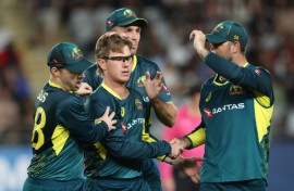 Australia's Adam Zampa celebrates the wicket of New Zealand’s Glenn Phillips