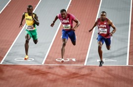 Jamaica's Ackeem Blake (L), Noah Lyles (C) and Christian Coleman (R) cross the finish line of the 60m