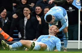 Erling Haaland (centre) and Phil Foden (right) scored in Manchester City's 3-1 win over Manchester United