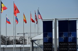 An empty mast is seen among member-nations at the NATO headquarters, ahead of a flag-raising ceremony for new member Sweden