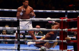 Down and almost out:  Anthony Joshua sends Francis Ngannou to the canvas