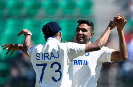 Off-spinner Ravichandran Ashwin (R) returned figures of 5-77 to help bowl out England for 195 inside three days at the picturesque Dharamsala stadium