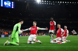 Arsenal celebrate their penalty shootout win over Porto in the Champions League last 16