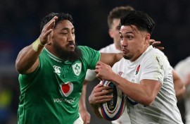 Bundee Aki (L) tackles Marcus Smith during Ireland's narrow defeat by England at Twickenham in the Six Nations
