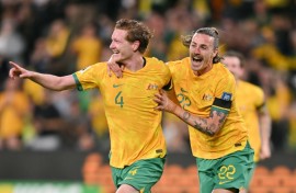 Australia's Kye Rowles celebrates scoring against Lebanon