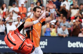 Andy Murray of Great Britain waves to the crowd after losing in three sets against Tomas Machac of the Czech Republic at the Miami Open on Sunday.