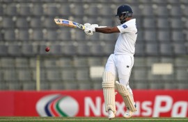Sri Lanka's Dimuth Karunaratne held firm to score 52 off 101 balls before his dismissal off Shoriful Islam in the day's final session