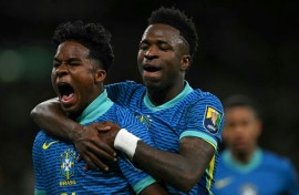 Brazil's Endrick (L) celebrates with Vinicius Junior after his winner against England