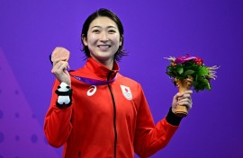 Rikako Ikee celebrates a bronze medal for the women's 50m butterfly at the Asian Games in Hangzhou last year