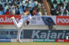Relaxed over home debut: England leg-spinner Rehan Ahmed pictured bowling in the third Test against India at Rajkot in February 