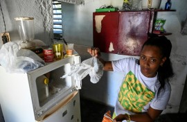 Diana Ruiz and her nearly empty refrigerator, photographed in Havana on March 27, 2024 