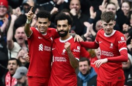 Liverpool's Mohamed Salah (C) celebrates after against Brighton