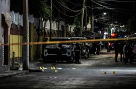 The body of Gisela Gaytan, candidate for mayor of the Mexican city of Celaya, lies on a street after she was gunned down while campaigning