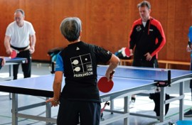 People play table tennis at the Ping Pong Parkinson initiative in Berlin on April 11, 2023, World Parkinson's Day -- the devastating disorder affects 10 million people worldwide
