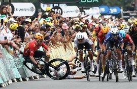 Norwegian rider Soren Waerenskjold (L) crashes during a sprint finish in the 2023 Tour de France