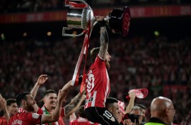Athletic Bilbao captain Iker Muniain raises the trophy after winning the Copa del Rey against Mallorca on penalties