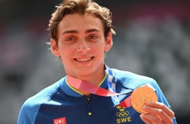 Olympic pole vault champion Armand Duplantis, pictured with his gold medal from the 2020 Tokyo Games, will receive $50,000 if he wins in Paris this year

ce celebrates on the podium with his gold medal after competing in the men's pole vault event during the Tokyo 2020 Olympic Games at the Olympic Stadium in Tokyo on August 4, 2021.
