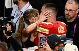 Taylor Swift, shown here kissing Travis Kelce at the 2024 Super Bowl, was spotted at Coachella similarly canoodling with her NFL boyfriend during the set of Bleachers, which is fronted by her producer