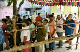 People queue to cast their votes at a polling station in Chennai as India's six-week election gets under way