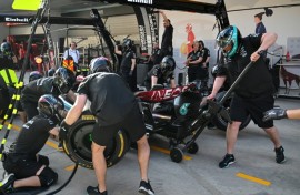 Mechanics practice pit stops with the car of Mercedes' British driver Lewis Hamilton ahead of the Formula One Chinese Grand Prix in Shanghai