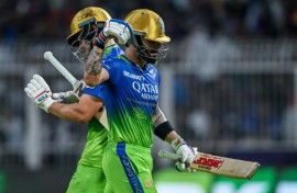 Angry: Virat Kohli (R) walks back to the pavilion after his controversial dismissal 