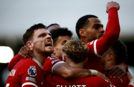 Andy Robertson (left) leads the celebrations after Liverpool's third goal 