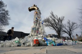 A sculpture titled "Giant Plastic Tap" by Canadian artist Benjamin Von Wong is displayed outside the fourth session of the UN Intergovernmental Negotiating Committee on Plastic Pollution that has wrapped up in Ottawa, Canada