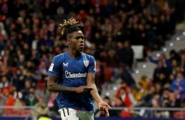 Athletic Bilbao's Spanish forward Nico Williams shows his skin colour as he celebrates scoring against Atletico Madrid on April 27
