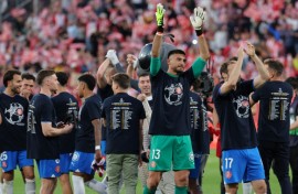 Girona players celebrate their qualification for the UEFA Champions League at the end of beating Barca at Montilivi