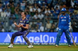Kolkata Knight Riders' Mitchell Starc (L) celebrates after his team's win against Mumbai Indians in the IPL