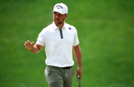 Xander Schauffele fired a four-under par 67 to grab the lead at the storm-hit PGA Wells Fargo Championship