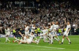 Real Madrid's players celebrate victory at the end of the Champions League semi-final second leg against Bayern Munich