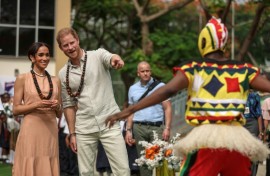 The couple were greeted at a school in Abuja by a drum and dance group from the Igbo ethnic group