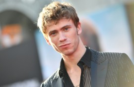 Actor Owen Teague, who stars in 20th Century's 'Kingdom of the Planet of the Apes,' poses during the film's world premiere in Hollywood, California on May 2, 2024 