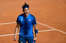 Alejandro Tabilo celebrates after winning against China's Zhang Zhizhen in the Rome Open quarter-finals