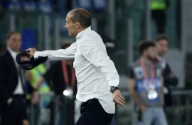 Juventus coach Massimiliano Allegri tosses away his tie after seeing red during his side's 1-0 victory against Atalanta in the Italian Cup final