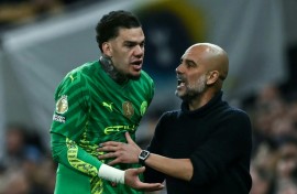 Reluctant to come off: Manchester City goalkeeper Ederson (L) argues with manager Pep Guardiola while being substituted during a 2-0 win over Tottenham Hotspur