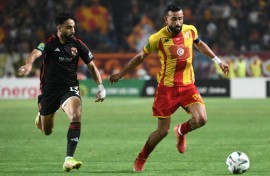 Marwan Attia (L) of Al Ahly challenges Ghaylene Chaalali of Esperance during the first leg of the 2024 CAF Champions League final in Tunisia. 