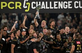 Triumph: Sharks players celebrate with the trophy after their European Challenge Cup final win over Gloucester at the Tottenham Hotsour Stadium