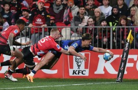 Blues winger AJ Lam scores a try but the Canterbury Crusaders fought back to score an upset 29-27 win in a Super Rugby Pacific quarter-final