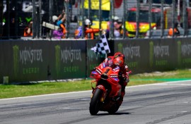 Ducati rider Francesco Bagnaia crosses the finish line in first place at the Catalunya MotoGP on Sunday