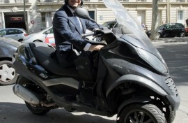 Candidate for the French Socialist Party 2012 primary elections, Francois Hollande is pictured on his scooter in Paris in 2011