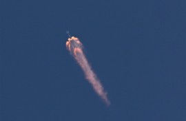 The EarthCARE satellite on a SpaceX Falcon 9 rocket is seen after launching from Vandenberg Space Force base in Lompoc, California