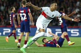 Paris Saint-Germain's French forward Kylian Mbappe netted twice against Barcelona at Montjuic in the Champions League